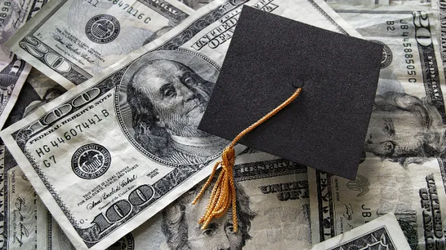 graduation cap with money